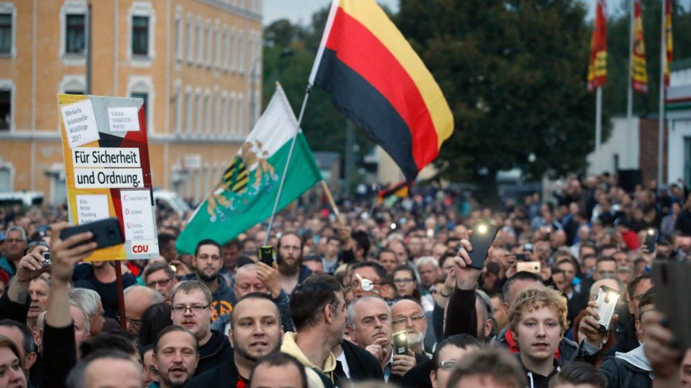 The far-right group "Pro Chemnitz" stage a protest at the entrance to the stadium of Chemnitz FC. 30 Aug 2018
