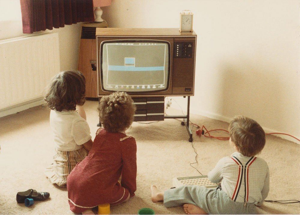 Children playing a computer game on a TV set