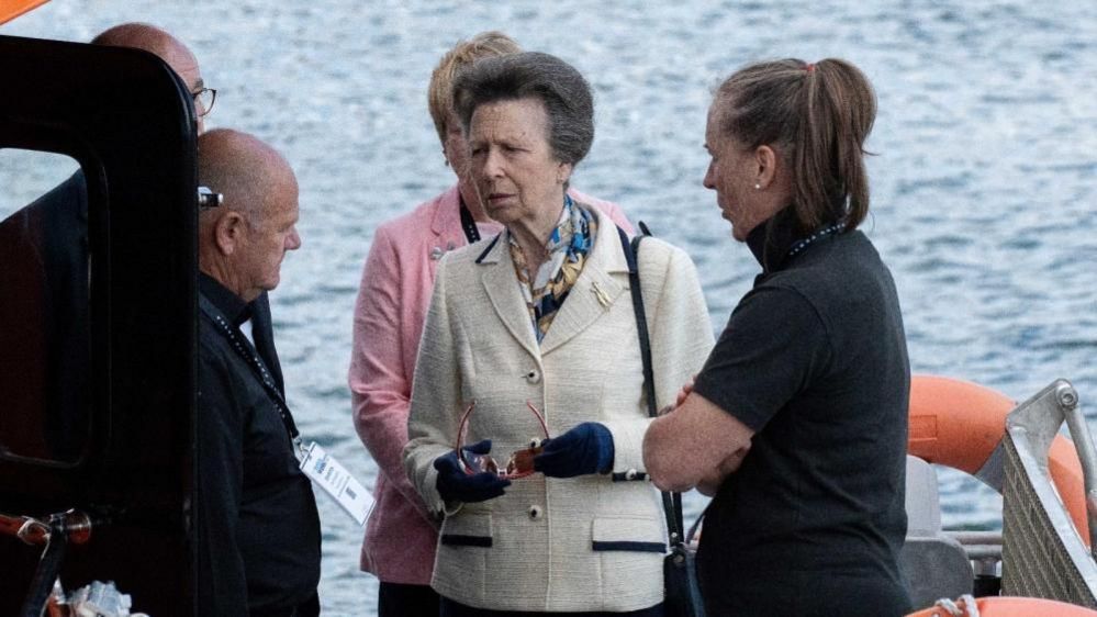 The Princess Royal speaking to Alan Goodchild on board one of his vessels built in Norfolk