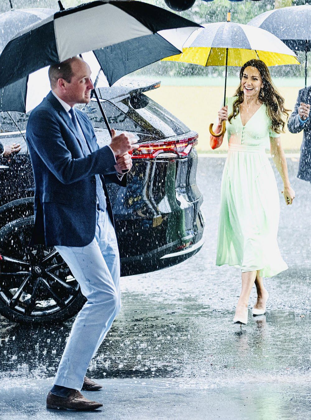 Prince and Princess of Wales in the rain