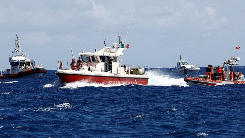 Rescue personnel work in the area where a luxury yacht sank, off the coast of Porticello, near the Sicilian city of Palermo, Italy, August 20, 2024