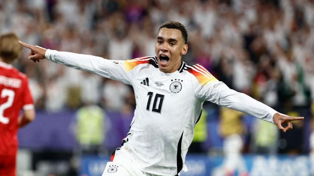 Jamal Musiala celebrates his goal for Germany against Denmark