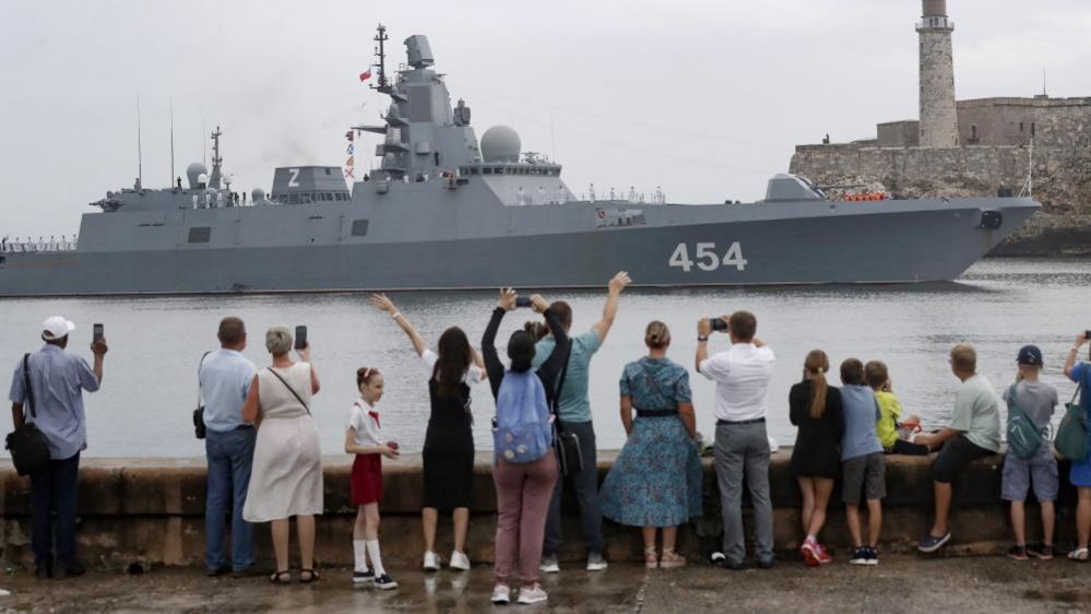 People watch the arrival of a Russian warship in Havana, Cuba