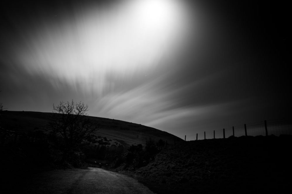 Moonlight over a barren landscape