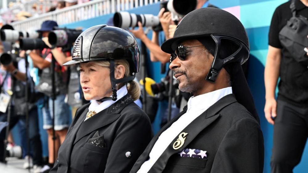 U.S. rapper Snoop Dogg watches the Dressage Team Grand Prix Special