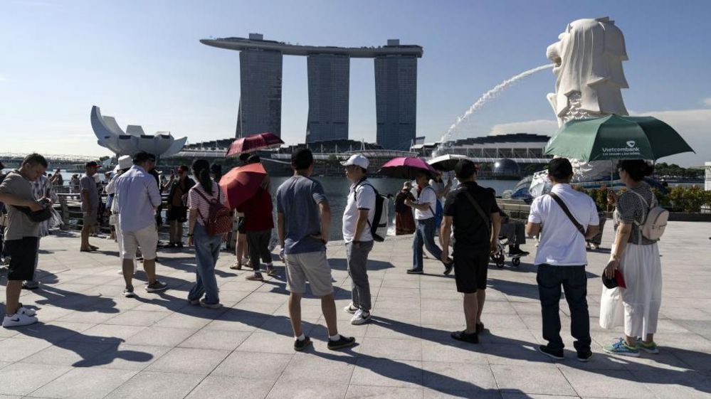 The Marina Bay Sands hotel and casino and the Merlion statue in Singapore, on Tuesday, May 14, 2024