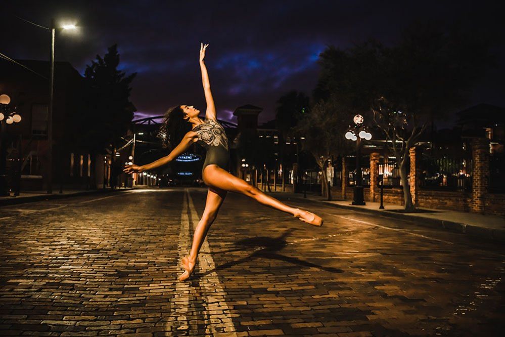 Dancer on a street at night