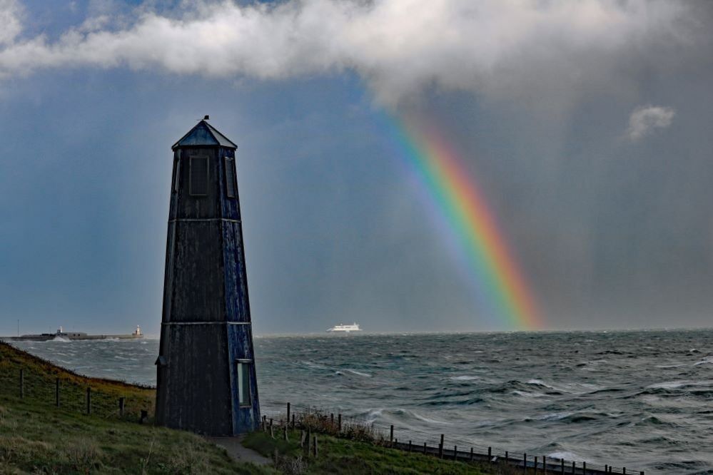 A rainbow above a ferry