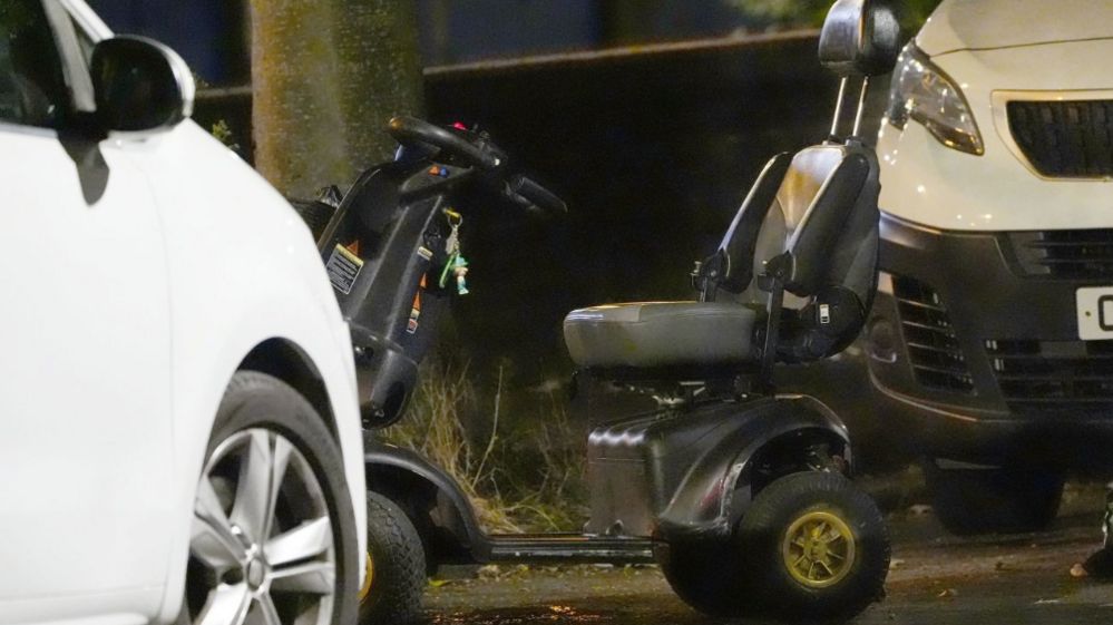 A black and grey wheelchair was pictured at the crime scene on Wednesday evening