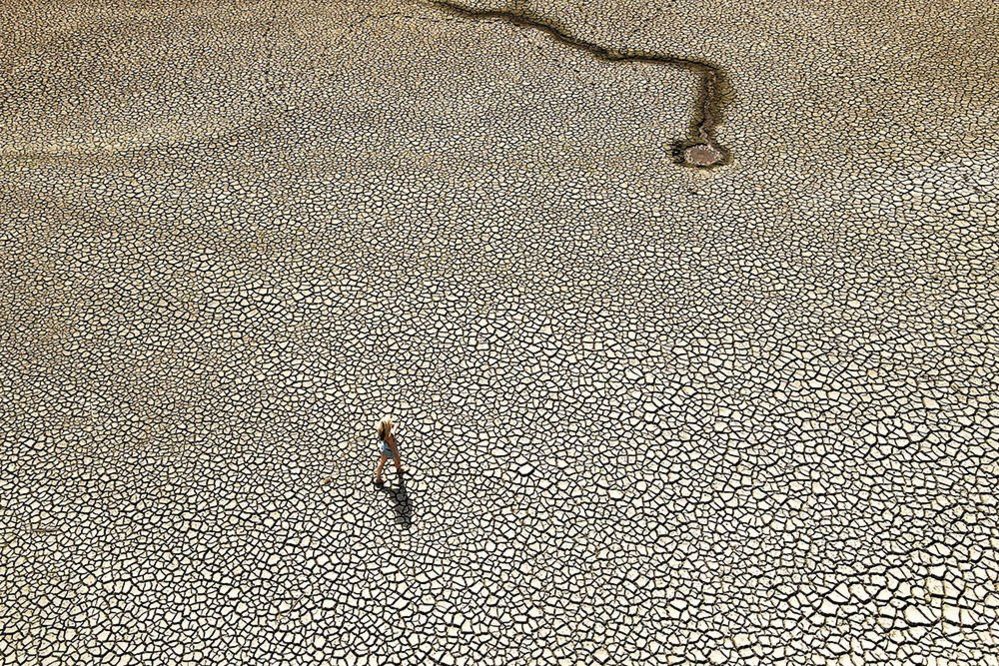 A person walks in the Wayoh Reservoir