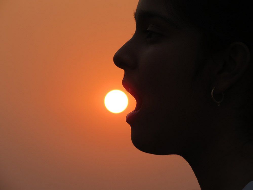 Woman 'eating' the sun
