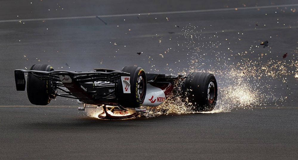 Alfa Romeo's Zhou Guanyu slides towards the barrier after a collision at the start of the 2022 British Grand Prix at Silverstone, 3 July 2022 of