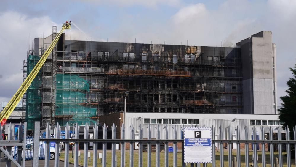 Firefighters at the scene after a blaze at a block of flats on Freshwater Road in Dagenham, East London