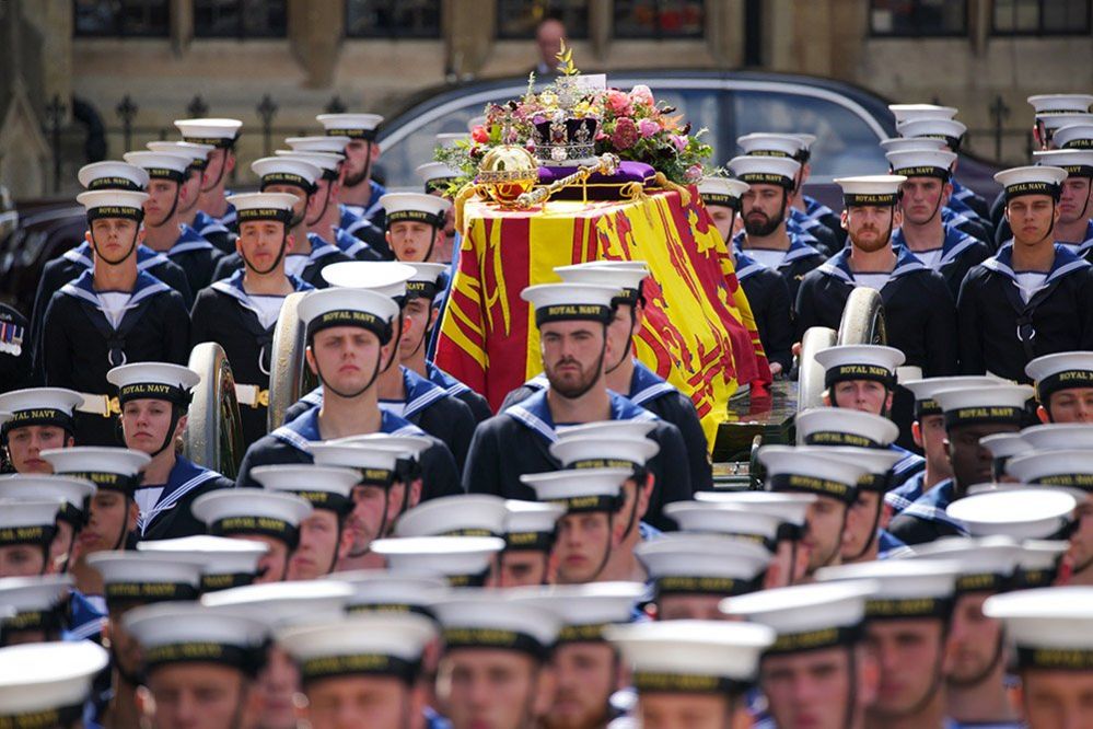 The coffin of Queen Elizabeth II being carried by pallbearers leaving the State Funeral held at Westminster Abbey, London, 9 September 2022