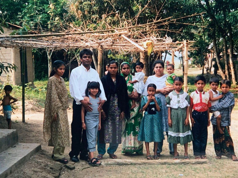 Qasa's mum and dad with the villagers
