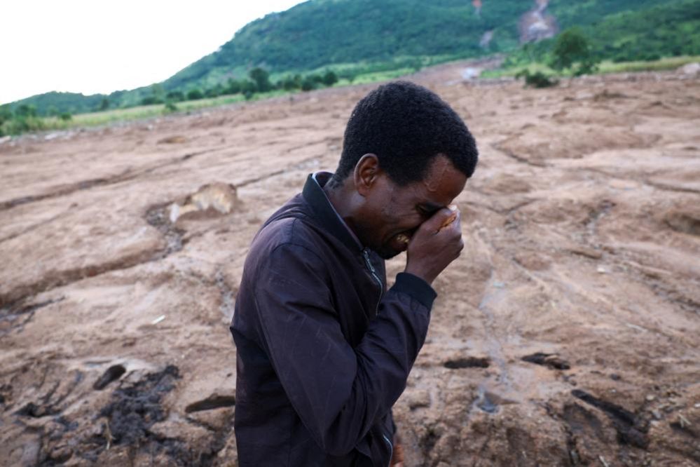 Hendry Keinga reacts after he lost a family member during the Mtauchira village mudslide in the aftermath of Cyclone Freddy in Blantyre, Malawi