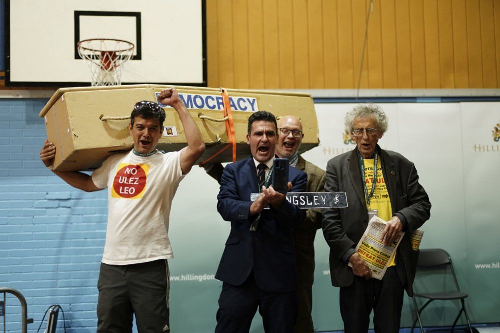 Candidates Leo Phaure (Independent), Kingsley Hamilton (Independent), Steve Gardner (Social Democratic Party), and Piers Corbyn (Let London Live) stage an anti-Ulez protest on stage after Conservative MP Steve Tuckwell won the Uxbridge and South Ruislip by-election