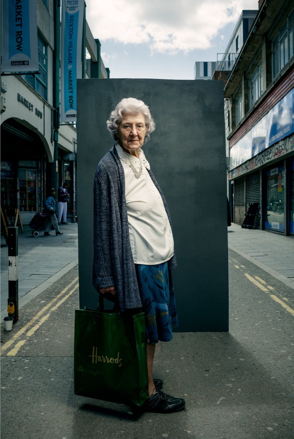 Portrait of a woman in the street holding a shopping bag