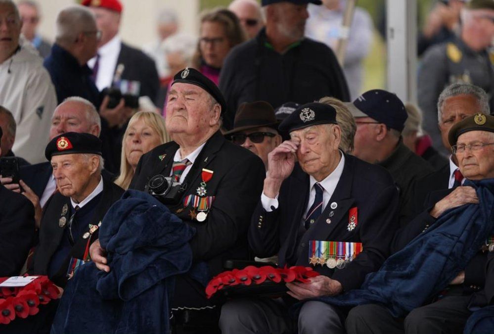 A D-Day veteran wipes away tears