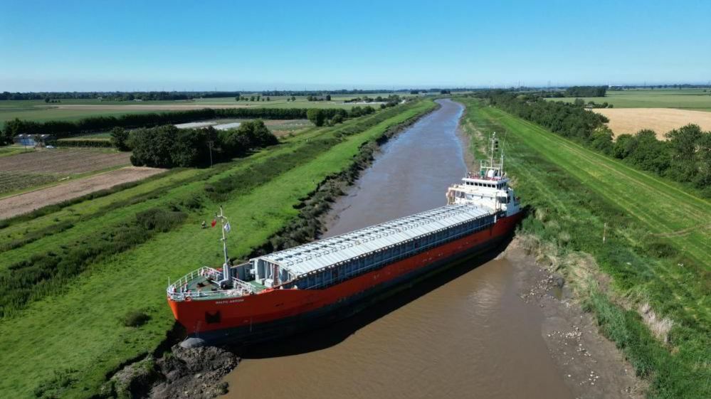 Ship wedged in river