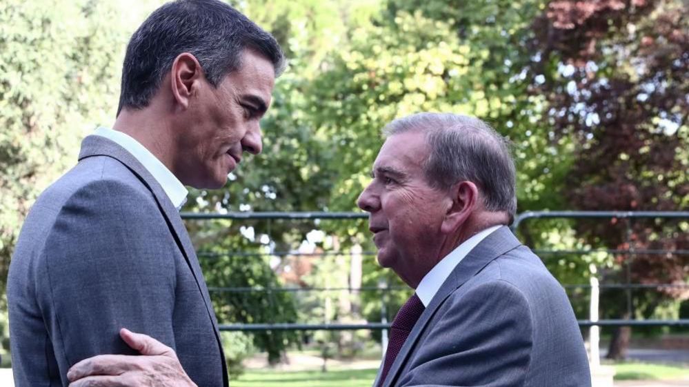 A handout photo made available by Spanish Prime Ministry Press Office shows Spanish Prime Minister Pedro Sanchez (L) greeting Venezuelan opposition leader Edmundo Gonzalez at La Moncloa Palace, in Madrid, Spain, 12 September 2024.