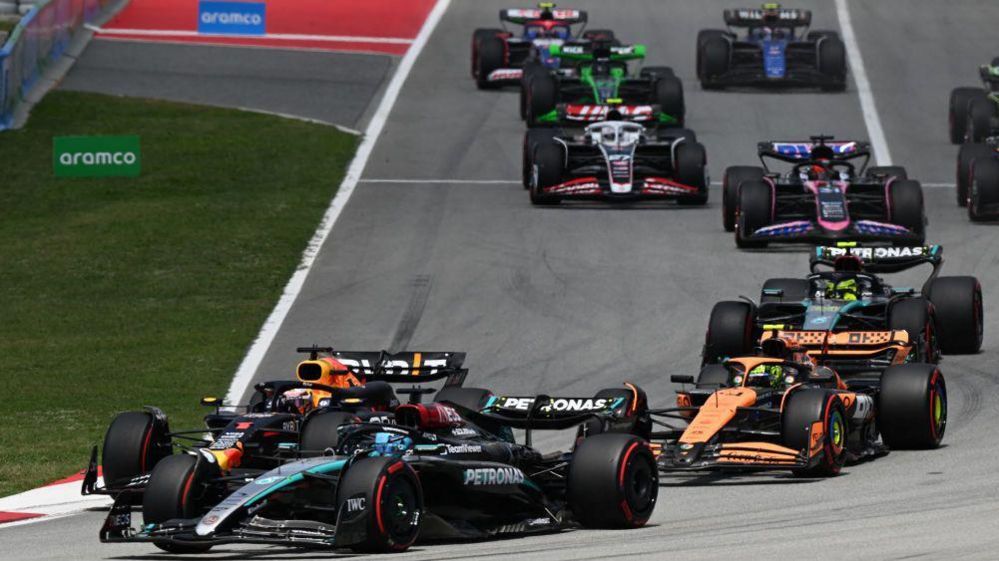 George Russell passes Lando Norris and Max Verstappen to take the lead at the first corner of the Spanish Grand Prix