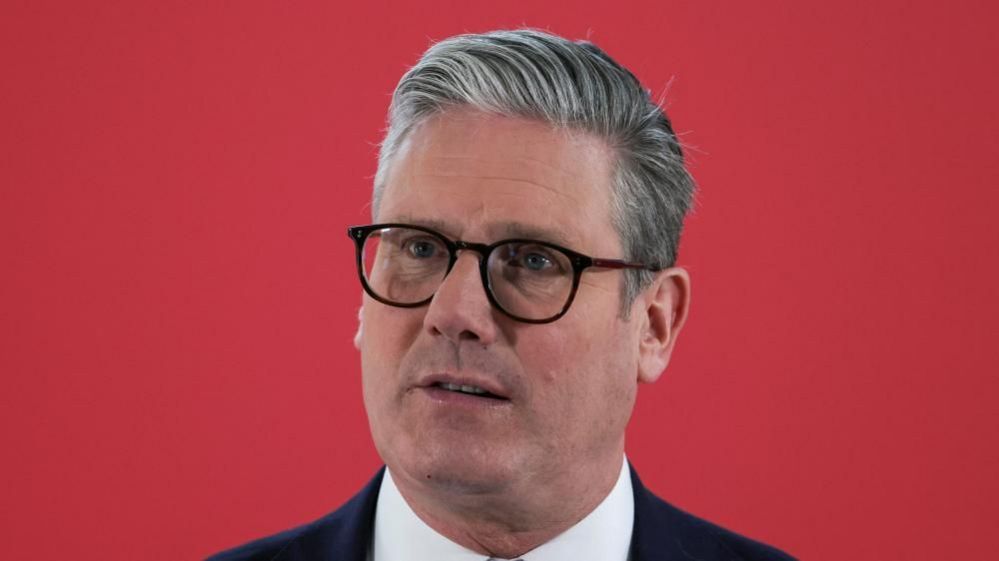 Sir Keir Starmer wearing glasses