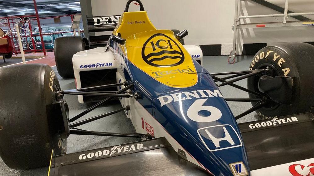 Blue, yellow and white Formula 1 car