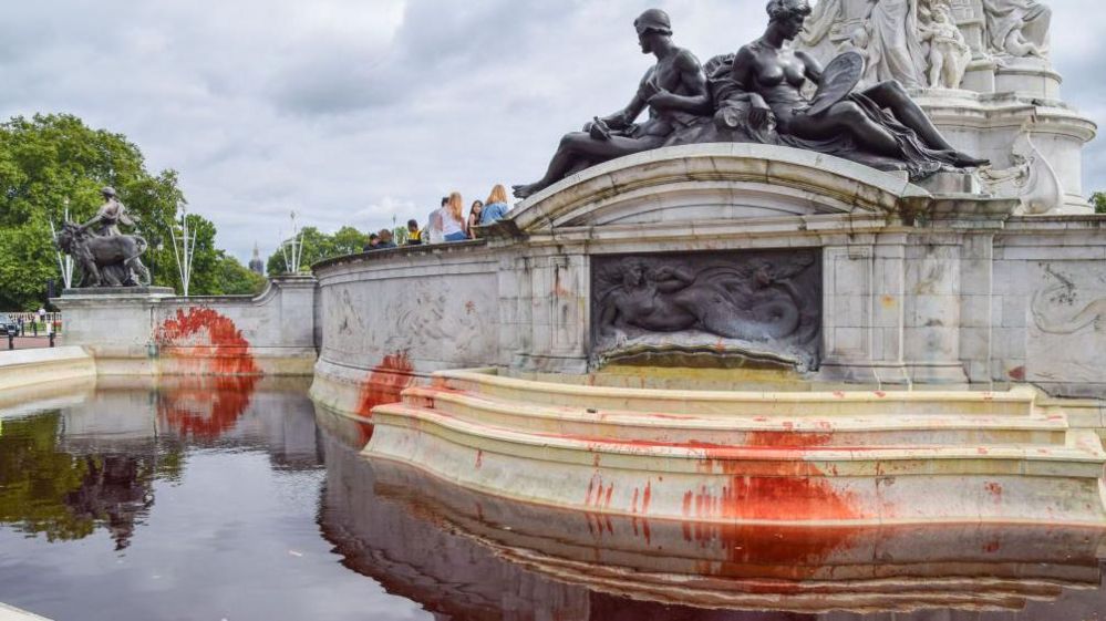 Fake blood is seen at the Victoria Memorial during the protest. 