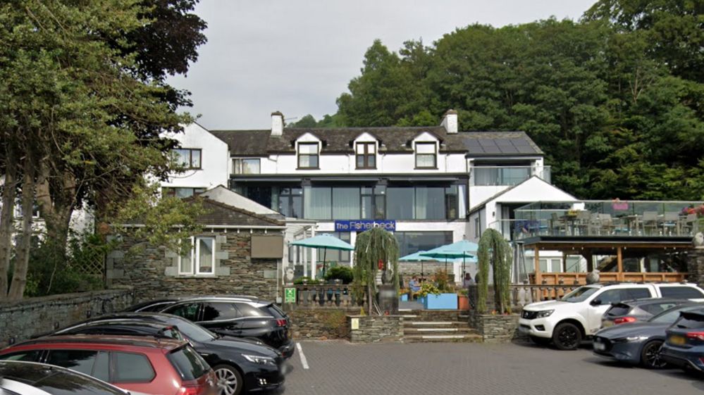 The Fisherbeck Hotel had a patio with tables and chairs and a car park