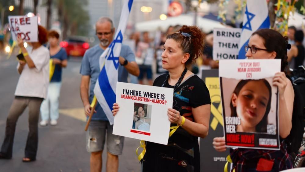 Protesters in Tel Aviv hold placards calling for the release of people kidnapped by Hamas (28 October 2023)