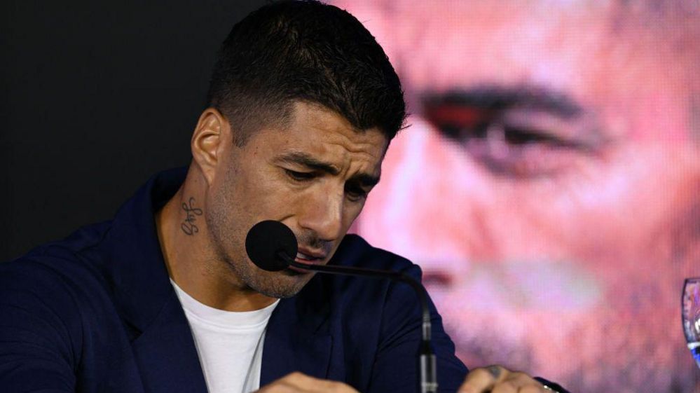 Luis Suarez holds back tears as he announces his international retirement