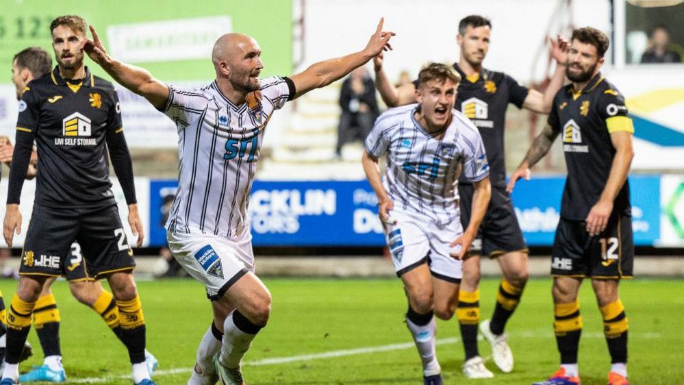 Dunfermline's Chris Kane celebrates as he scores to make it 3-0