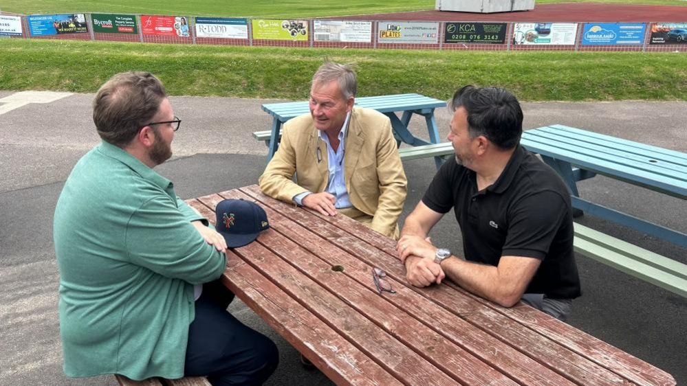 Rupert Lowe with Jack Jay and Martin Sinclair near the football pitch