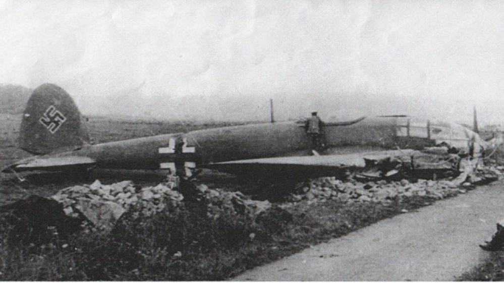 A black and white photo of a crashed German bomber plane on the Mendips. 