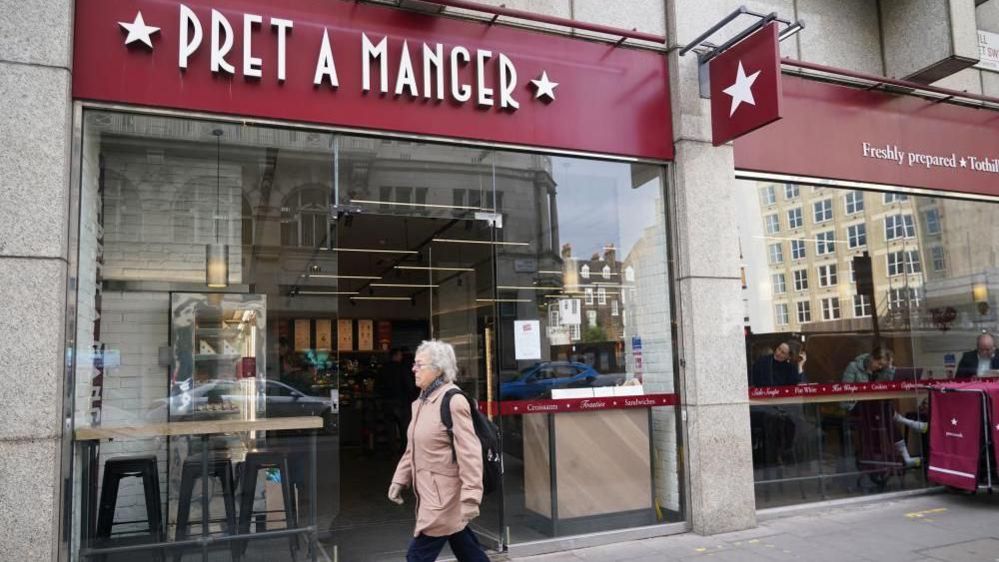 A person walks past a Pret a Manger in London