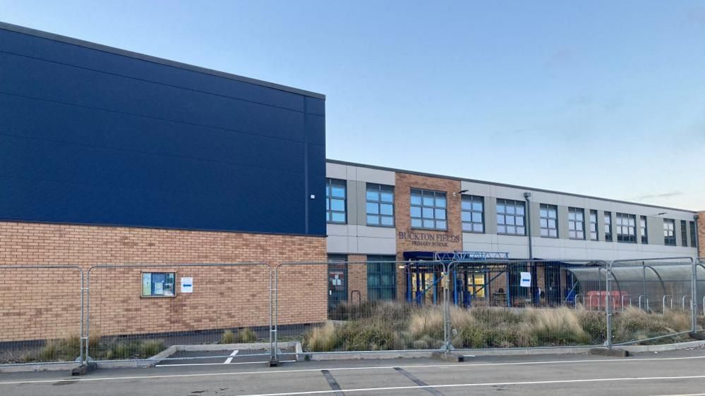 The closed Buckton Fields Primary building, with fencing around it