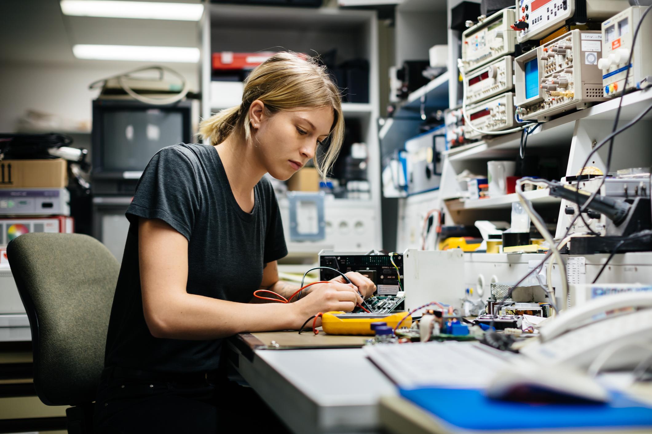 Caucasian woman playing with electronic accessories