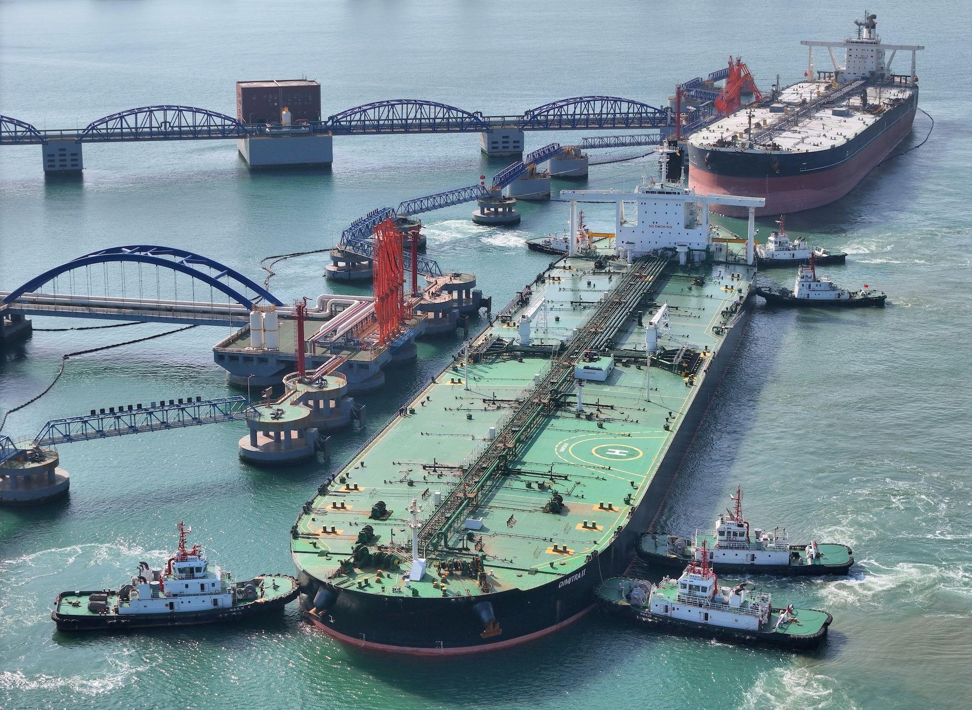 A very large oil tanker is being assisted by a tugboat as it berths at Yantai Port's 300,000-ton crude oil terminal in Yantai, Shandong Province, China, on April 25, 2024. 