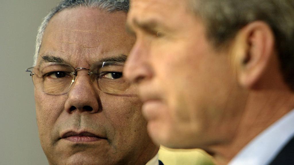 A close-up of Colin Powell (left) and George W. Bush in 2002