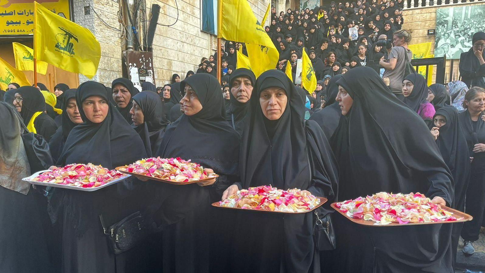 Women with trays of petals