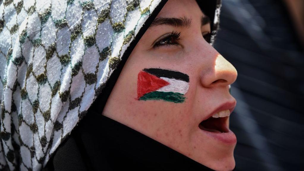 A woman takes part in a demonstration against Israel's military offensive in the Gaza Strip in Sao Paulo, Brazil
