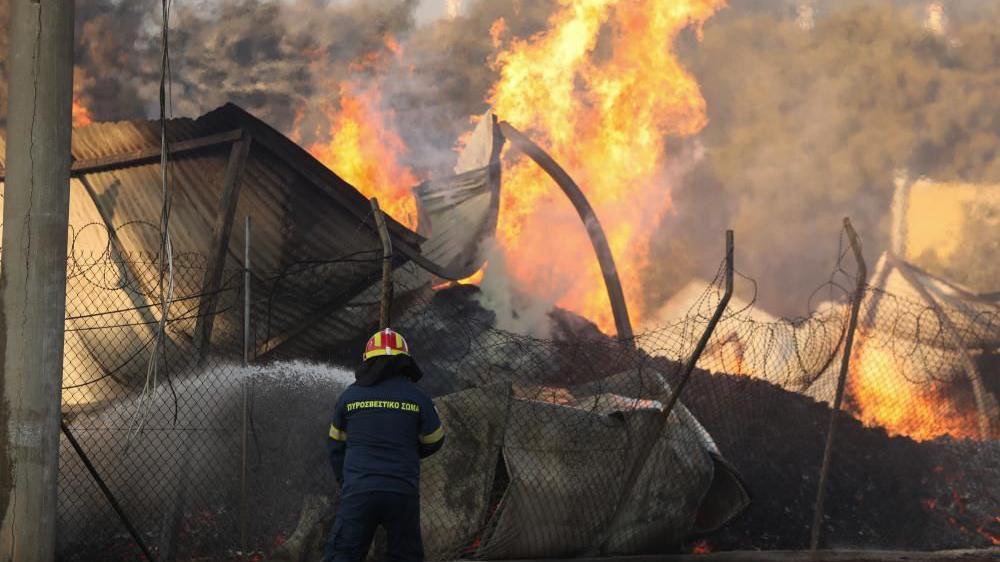 One dead as wildfires rage across Athens suburbs