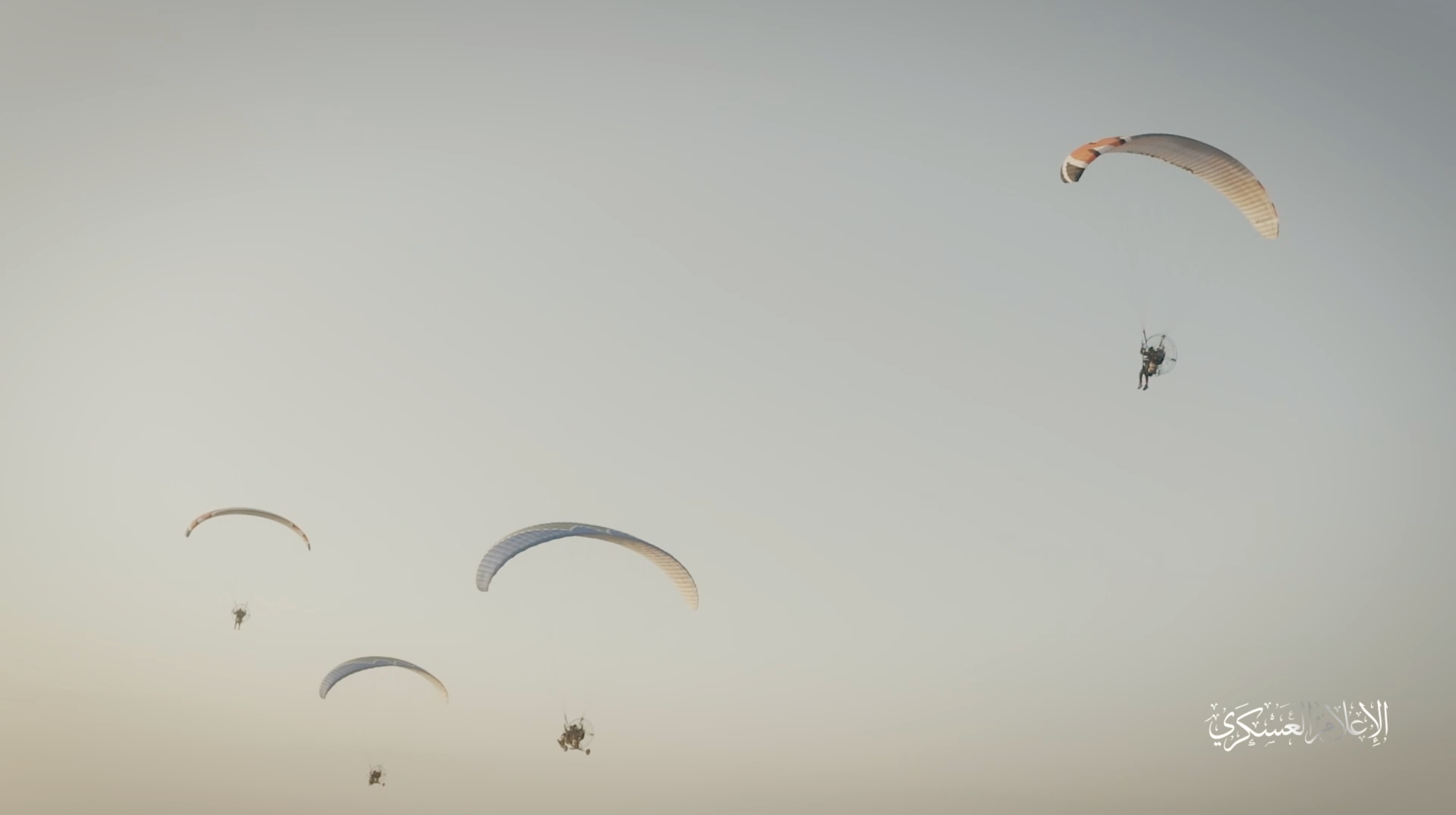 Hamas fighters in motorised harnesses attached to parachutes