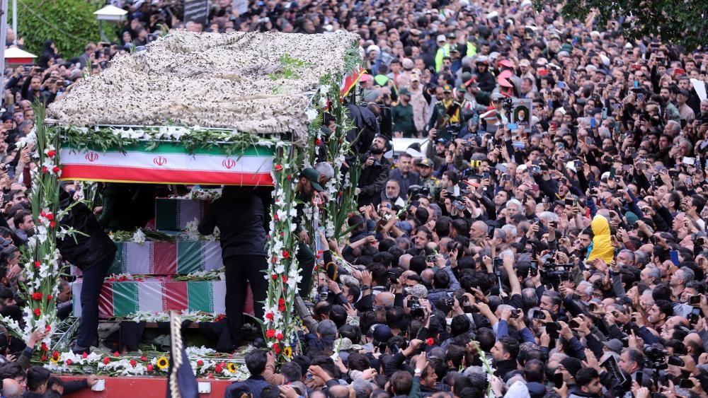 Thousands at Iran presidents funeral procession