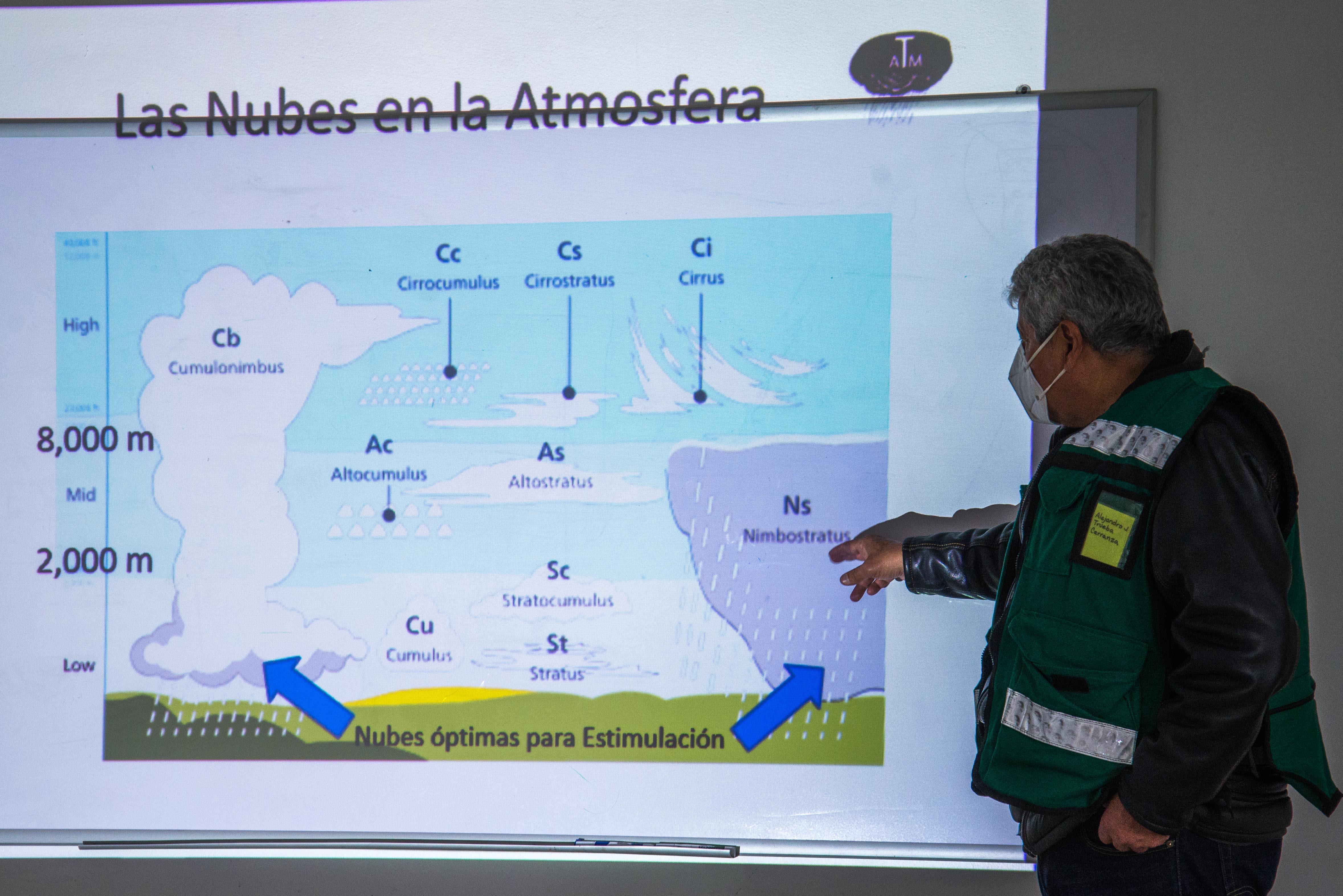 An official shows a cloud cover chart