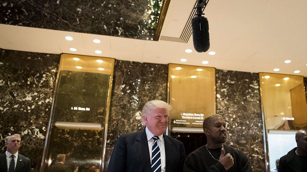 Donald Trump and Kanye West outside the famous golden elevators of Trump Tower, New York City, in December 2016