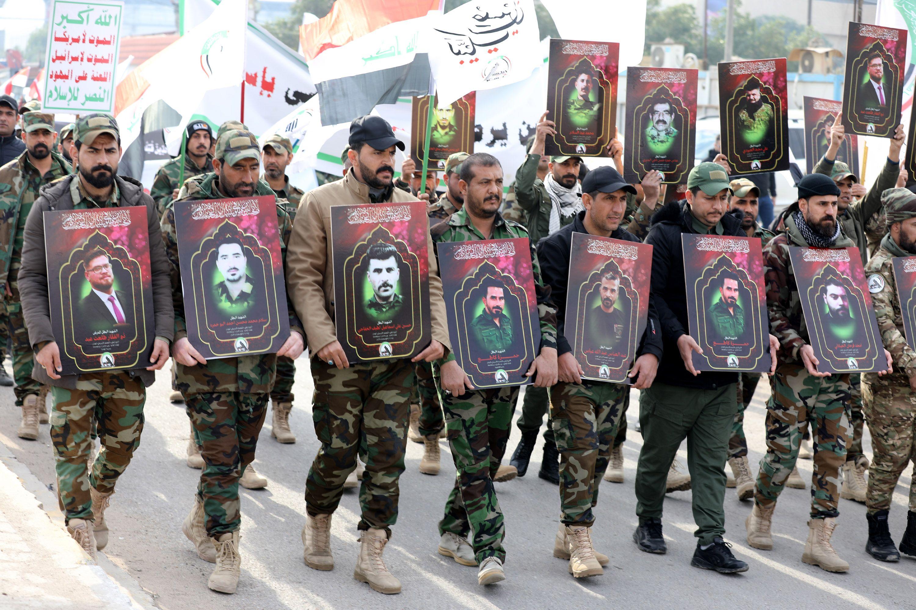 Members of the Iraqi Shiite Popular Mobilisation Forces (PMF) carry images of their comrades, who were killed in recent US air strikes in western Iraq, during a funeral procession in Baghdad, Iraq, 04 February 2024