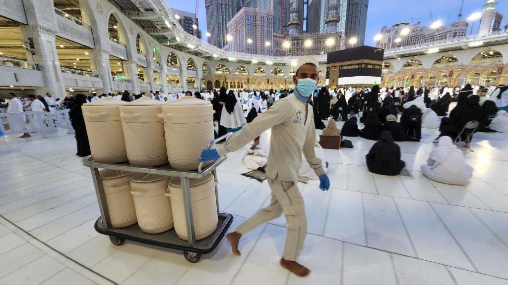 Officials provide Zamzam water to prospective pilgrims at Masjid al-Haram (Grand Mosque), where the Islam's holiest site the Kaaba is located