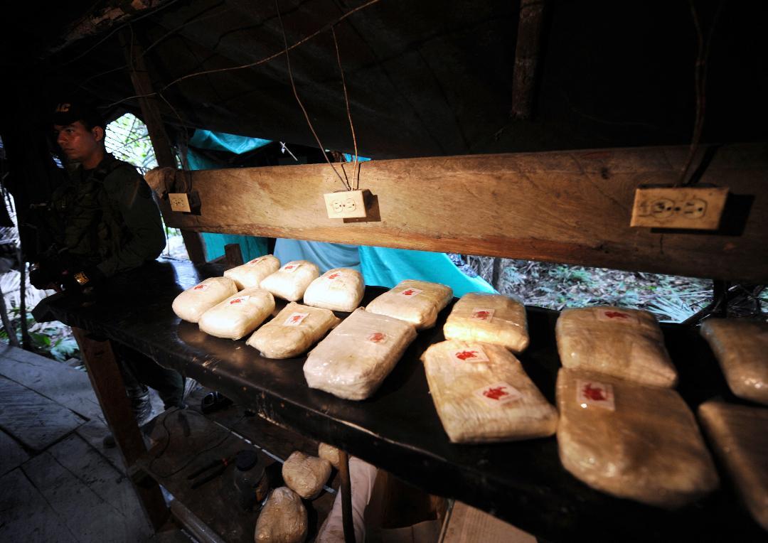 A member of the Venezuelan National Guard conducts operations in a drug laboratory.